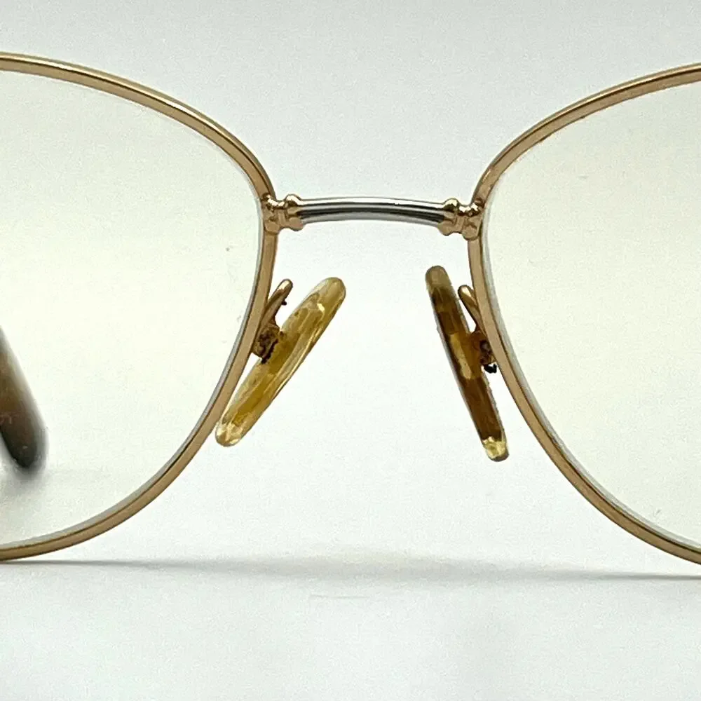 Tura has gold eyewear